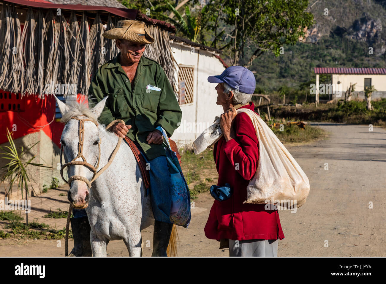 Farmers stop for a chat in a local village - VINALES, PINAR DEL RIO, CUBA Stock Photo