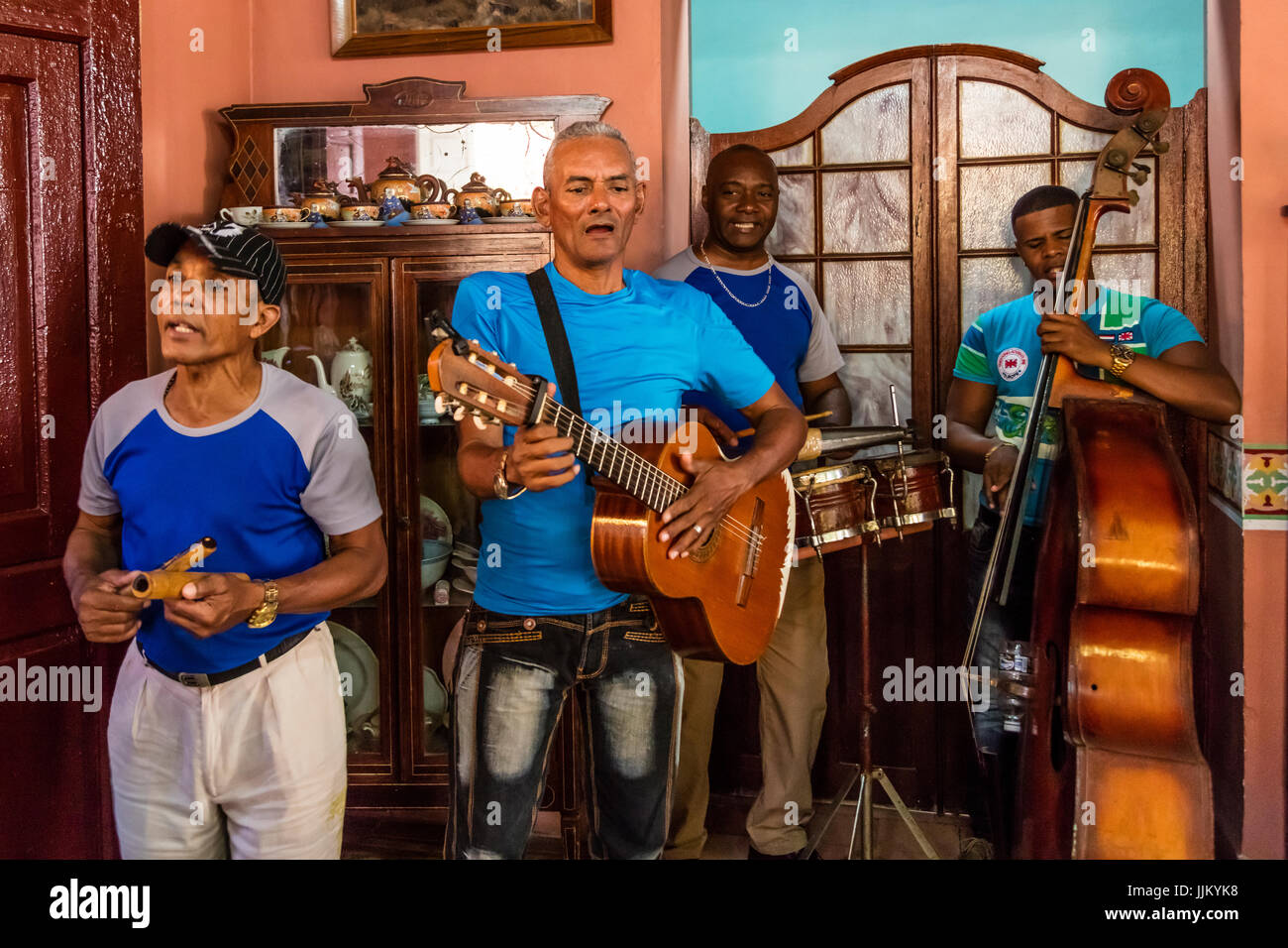 A SALSA BAND entertains tourists in one of the many restaurant - TRINIDAD, CUBA Stock Photo