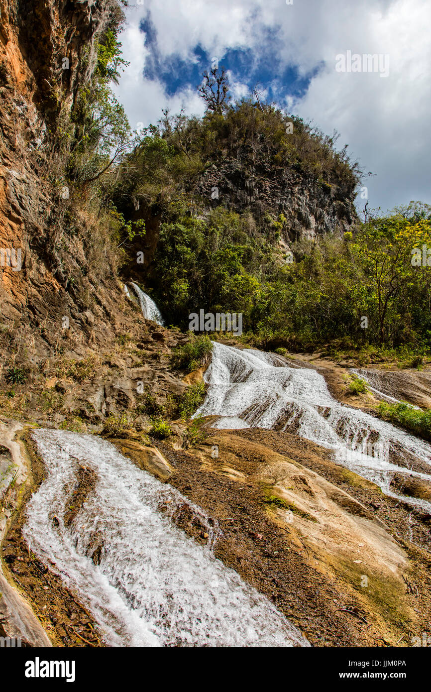 The 62 meter waterfall at SALTO DE CABURNI located in the TOPES DE COLLANTES in the mountains of SIERRA DEL ESCAMBRAY - CUBA Stock Photo