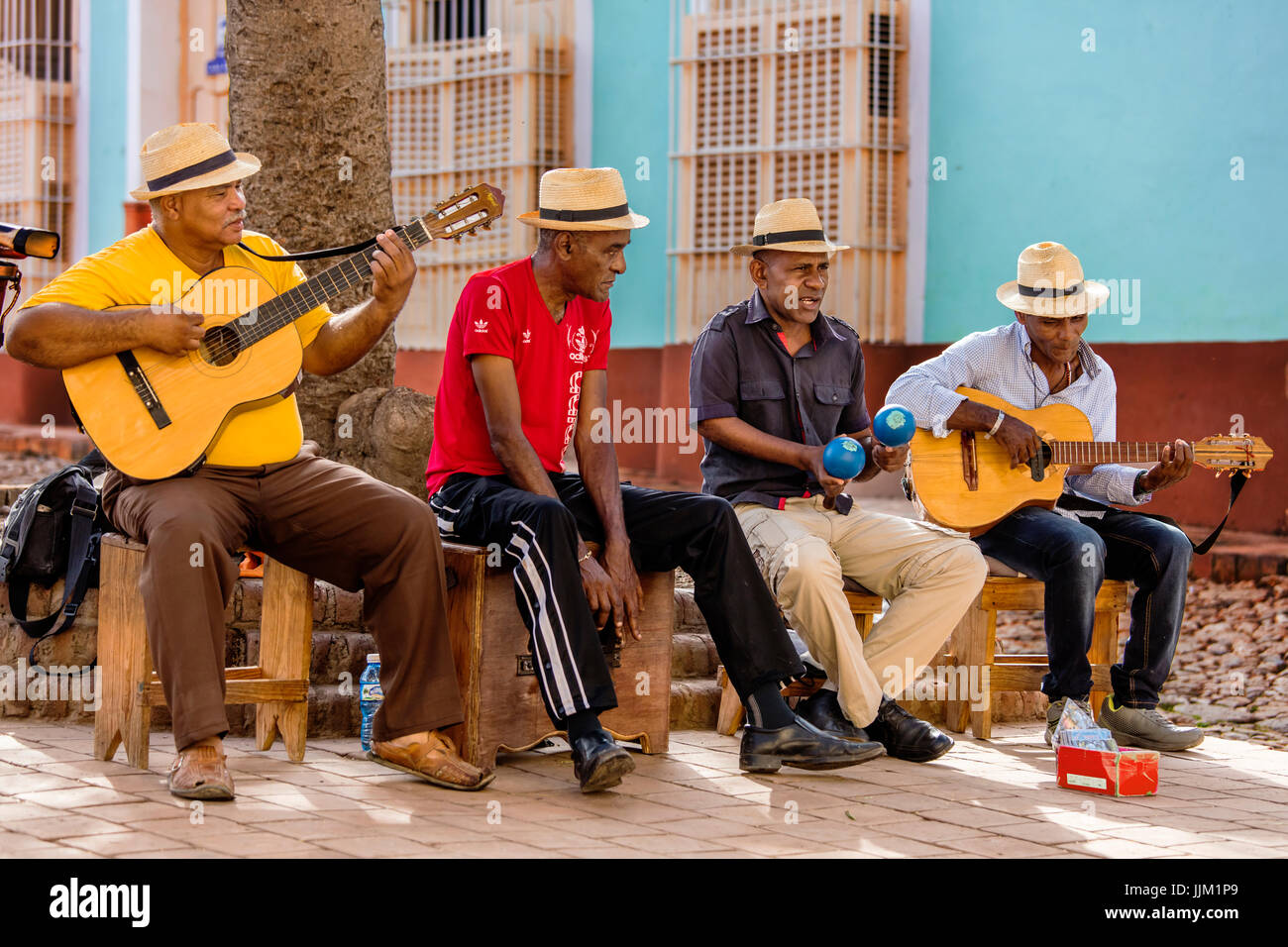 A CUBAN band plays traditional music in a courtyard TRINIDAD, CUBA