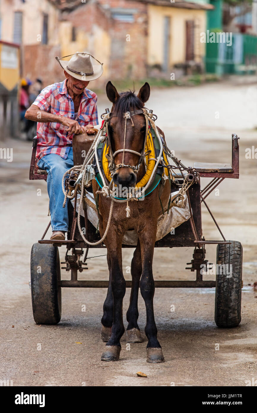 A horse drawn cart is a common site in the historic town of TRINIDAD, CUBA Stock Photo