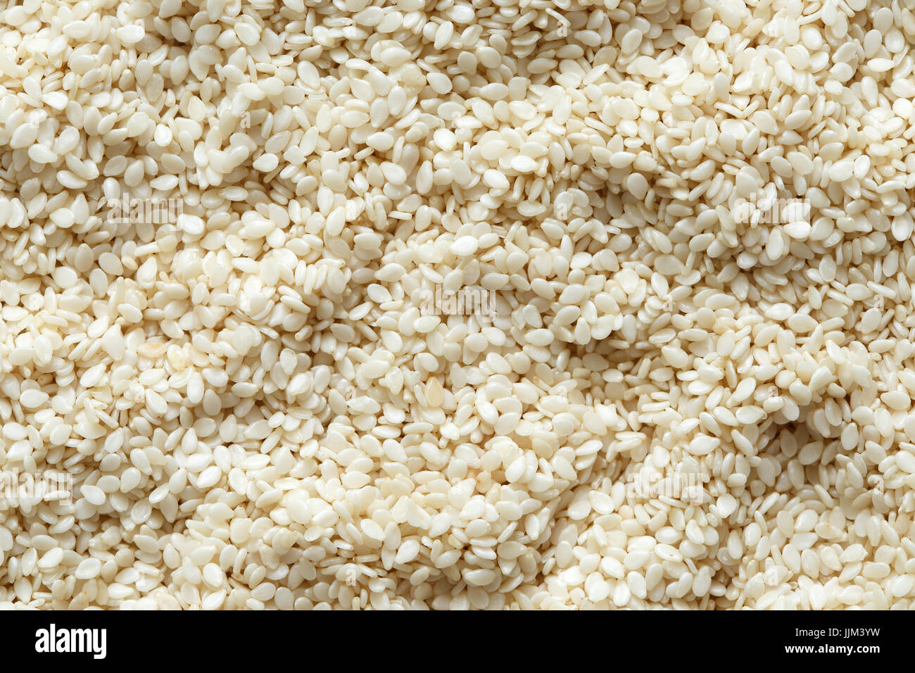 Background of decorticated sesame seeds Stock Photo Alamy