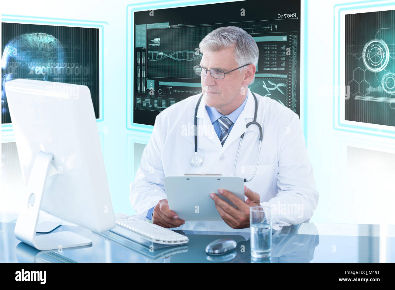 Composite 3d image of male doctor holding clipboard while looking at computer monitor Stock Photo