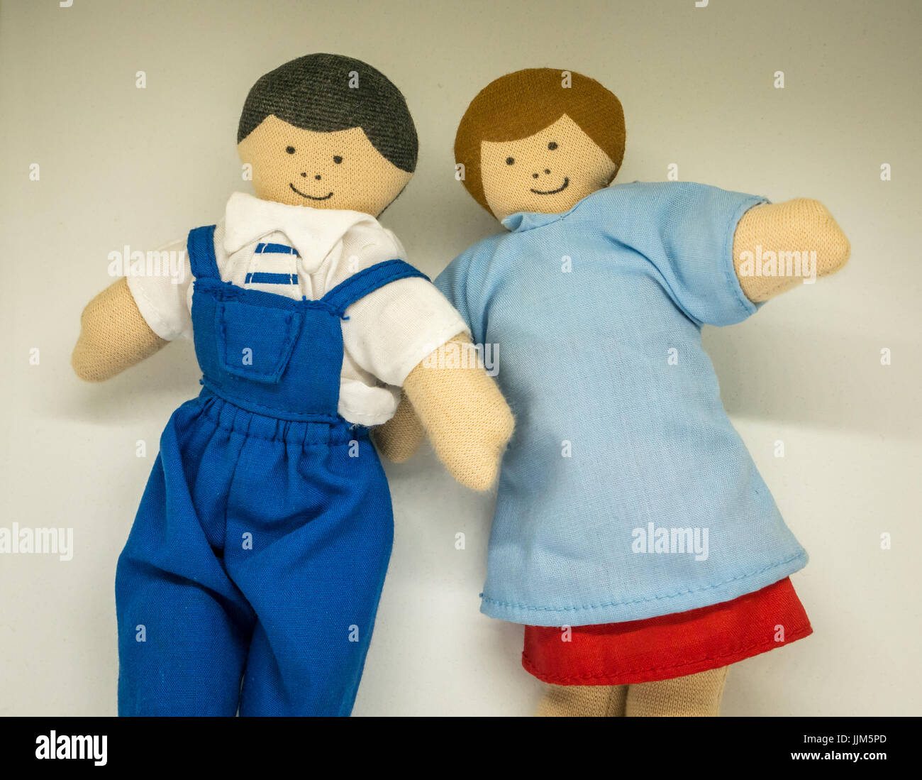 still life of male and female toy dolls against white background to  represent parents, couple, family members, relationships, marriage, genders  Stock Photo - Alamy