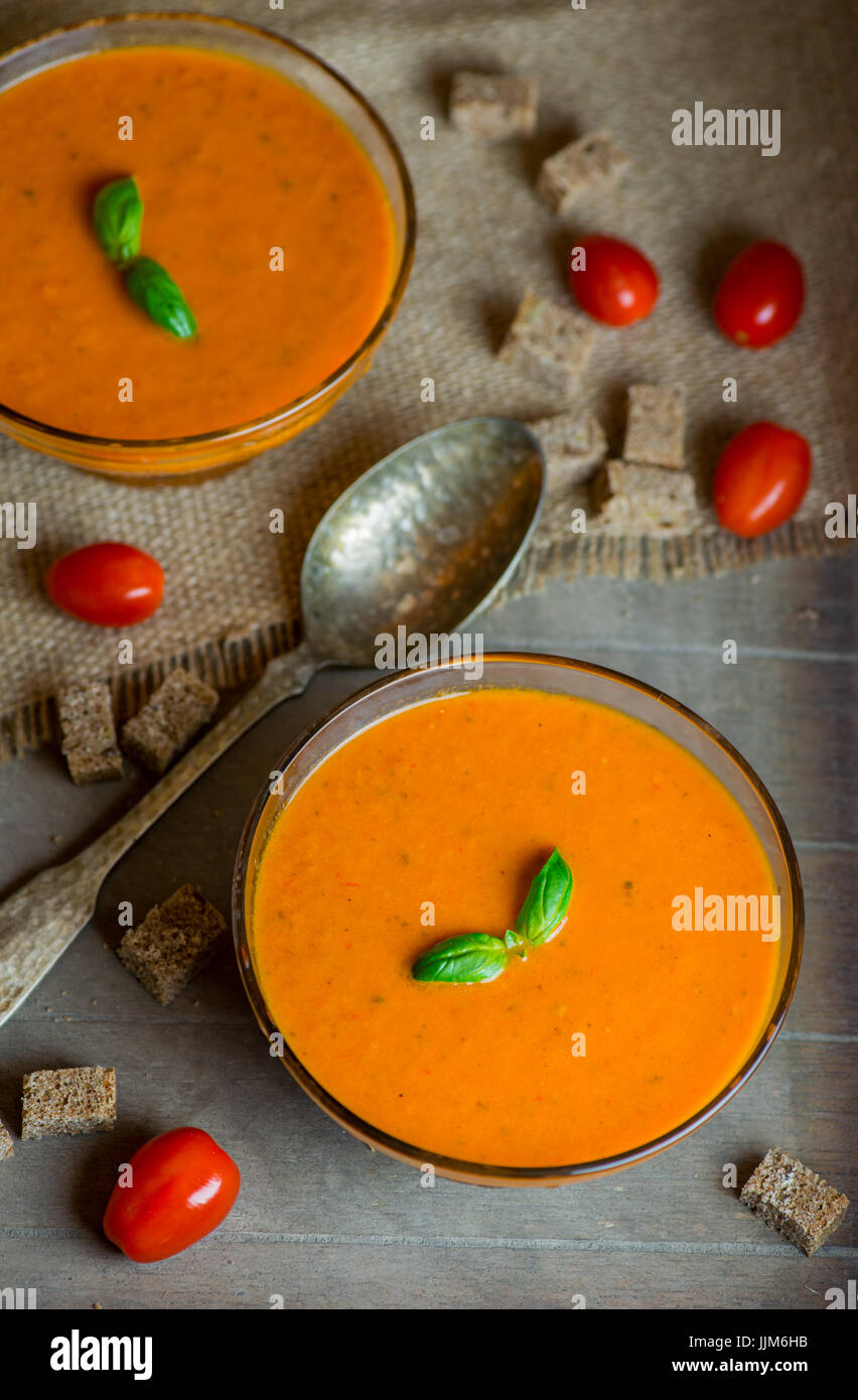 Homemade Tomato soup on wooden table Stock Photo