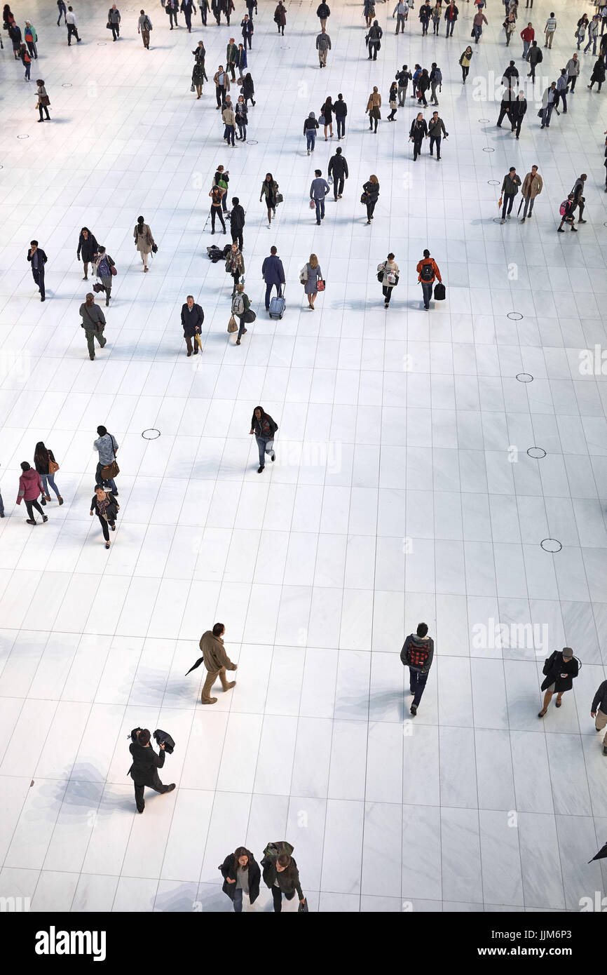 NEW YORK CITY - SEPTEMBER 30, 2016: People moving around on the ground floor inside the Oculus building in Westfield World Trade Center Stock Photo
