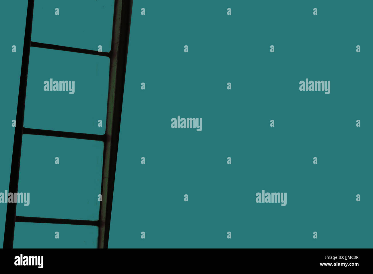 ladder on green background,climbing on ladder Stock Photo - Alamy