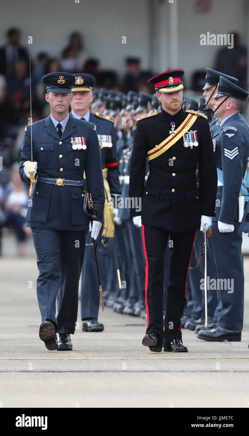 Prince Harry inspects the honour guard as he arrives at RAF Honington in Suffolk where will present a new Colour to the ground fighting force of the RAF in its 75th anniversary year. Stock Photo