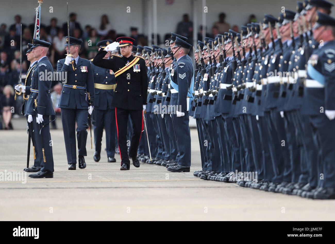 Prince Harry inspects the honour guard as he arrives at RAF Honington in Suffolk where will present a new Colour to the ground fighting force of the RAF in its 75th anniversary year. Stock Photo