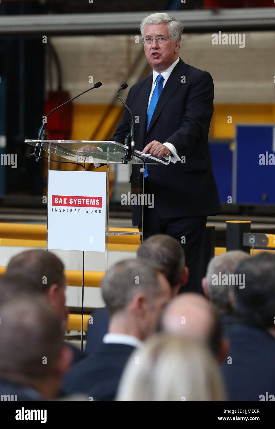 Defence Secretary Sir Michael Fallon speaks to the invited audience ahead of cutting steel on the first Type 26 frigate at BAE System's Govan Shipyard near Glasgow. Stock Photo