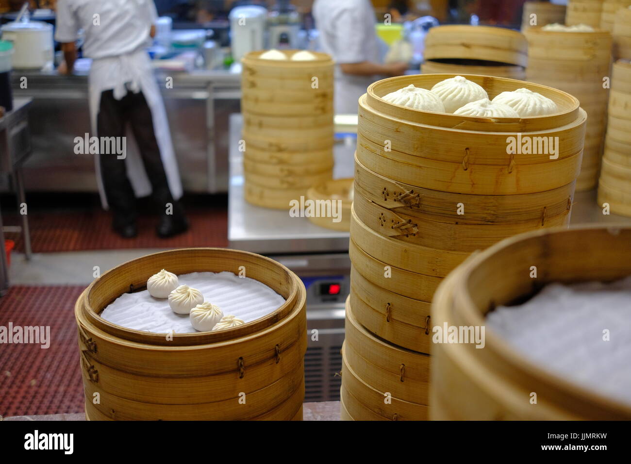 Preparing Dim Sum in a Chines Malaysian restaurant, the dumplings are freshly prepared and cooked to order. Stock Photo