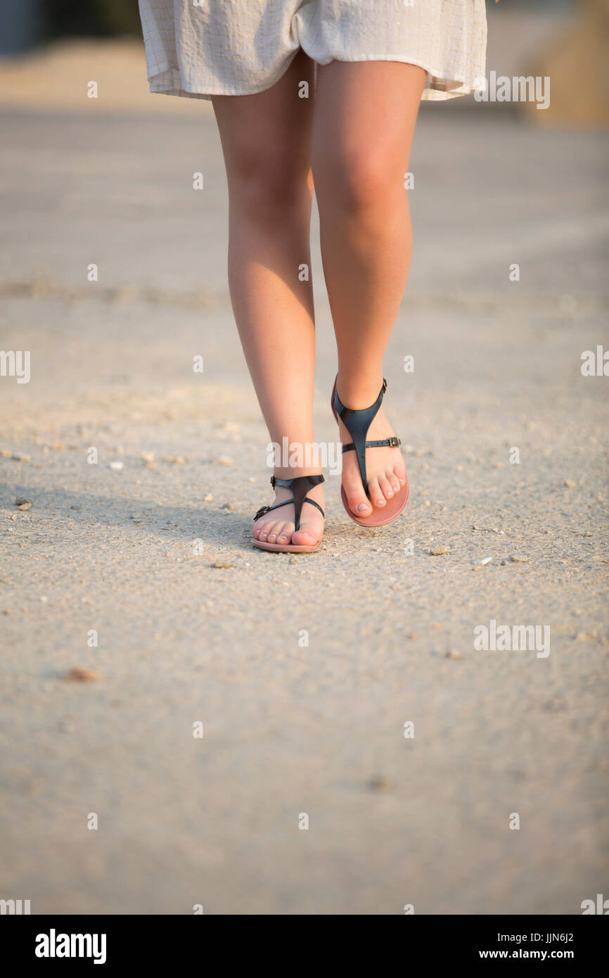 Woman wearing sandals hi-res stock photography and images - Alamy