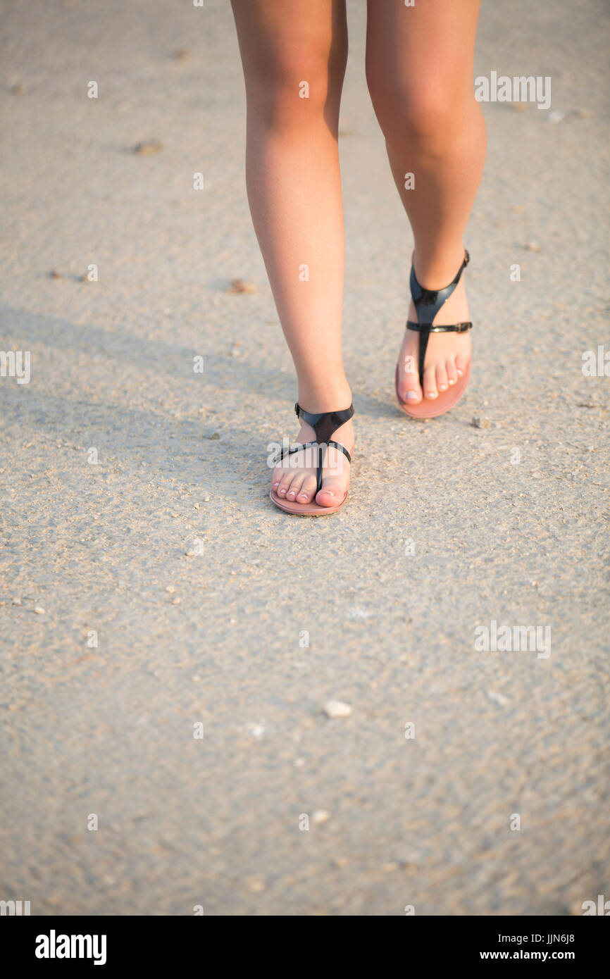 Close up of a woman's feet wearing sandals walking outdoors Stock Photo -  Alamy