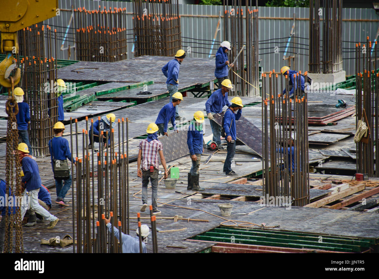 Construction workers on a high rise building in Bangkok, Thailand Stock Photo