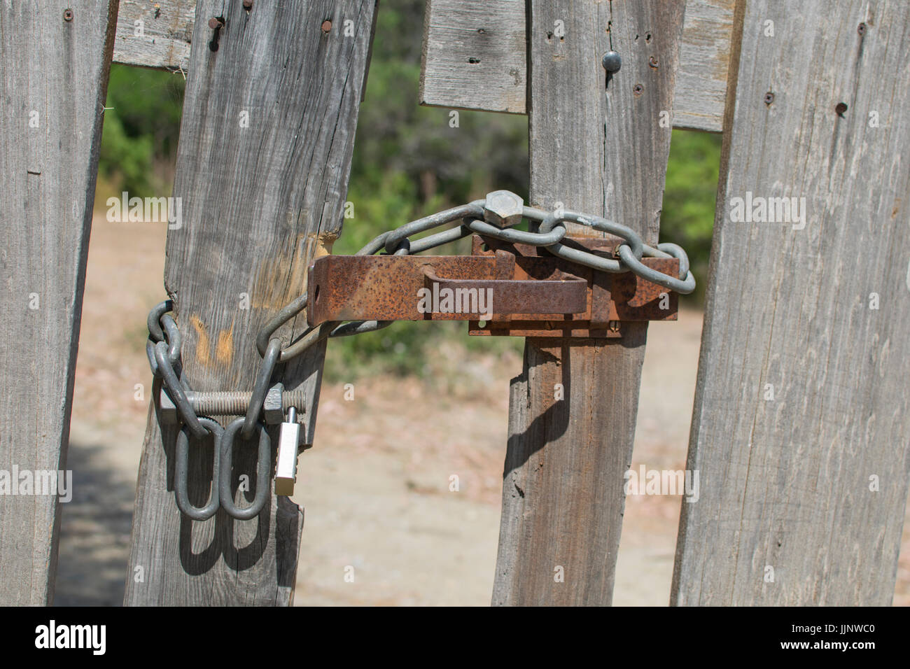 Heavy locked wood door Stock Photo Alamy