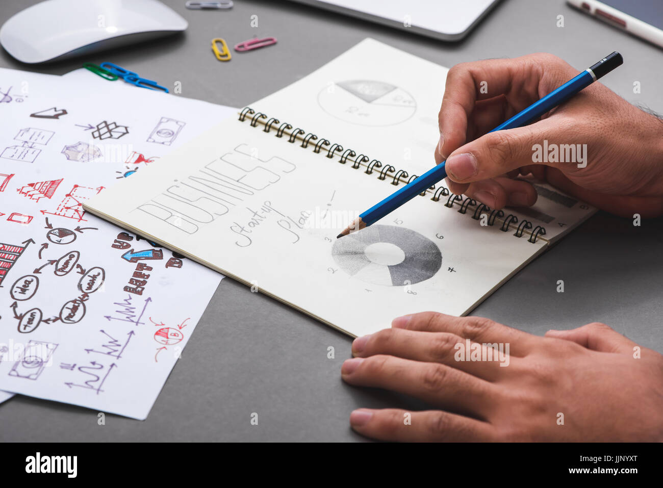 Business concept. Businessman writing idea sketch Stock Photo