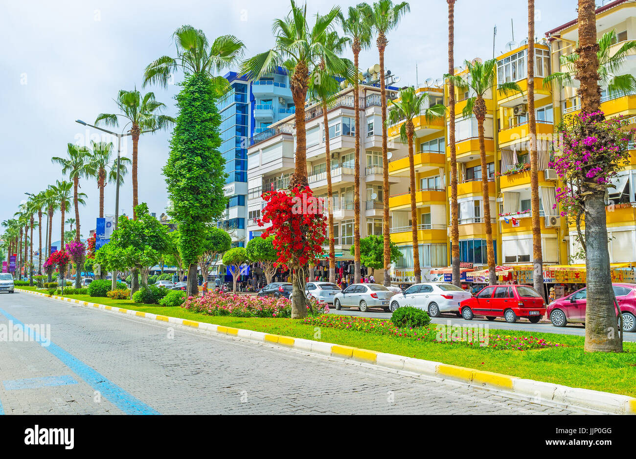 ALANYA, TURKEY - MAY 9, 2017: The Ataturk Boulevard is the central shopping street, decorated with different plants and flowers, here the colorful flo Stock Photo
