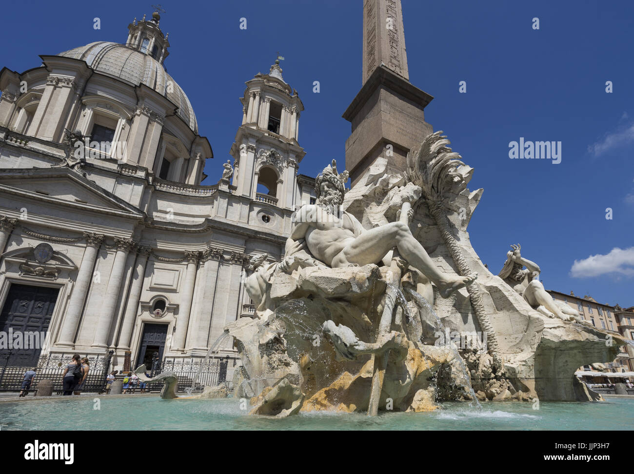 Famous Piazza Navona Square Fountain of the Four Rivers with an Egyptian obelisk in Piazza Navona. Rome, Italy. June 2017 Stock Photo