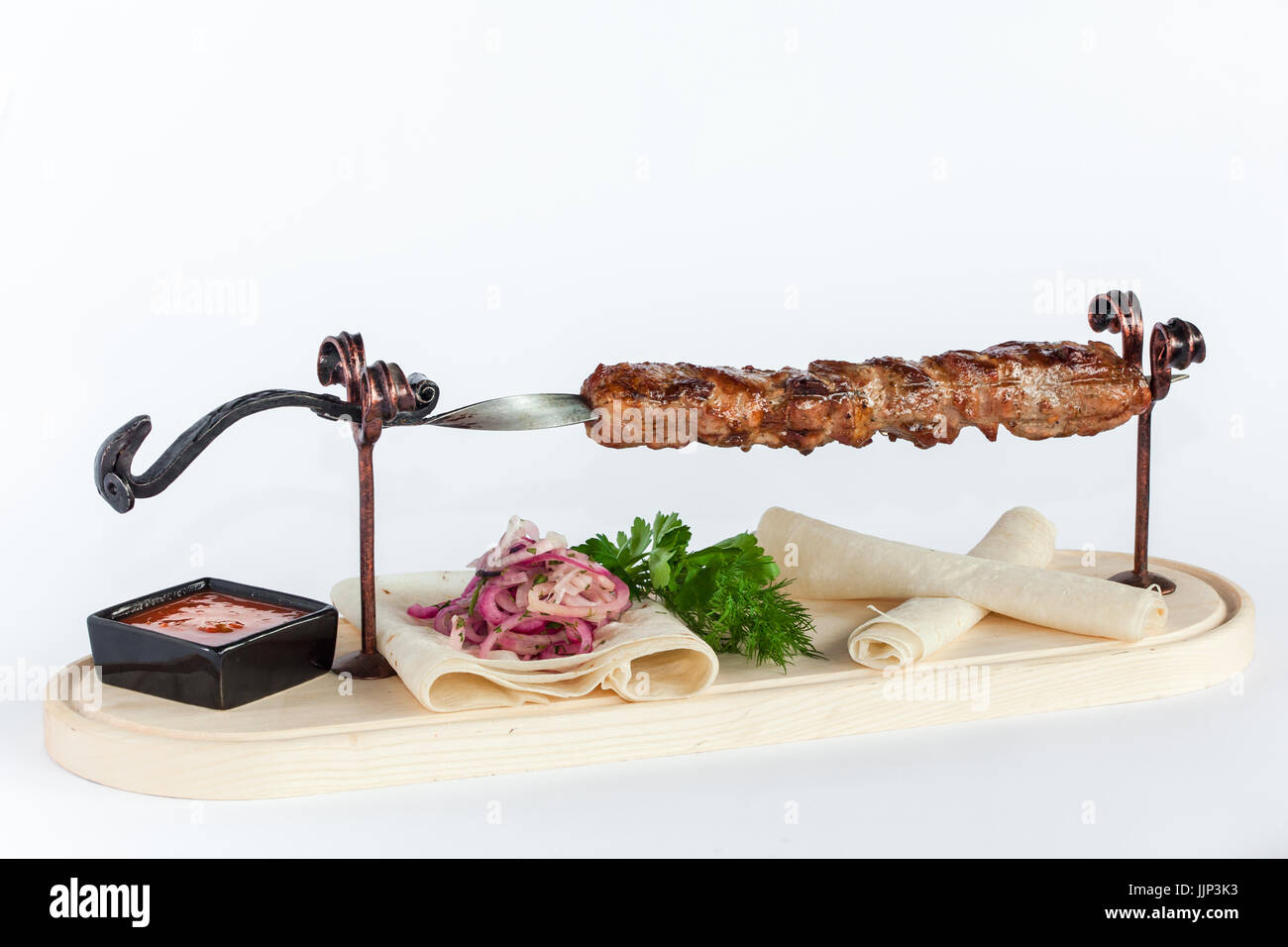 Close Up of Rack of Saucy Barbecue Pork Served on Plate in Restaurant Stock Photo