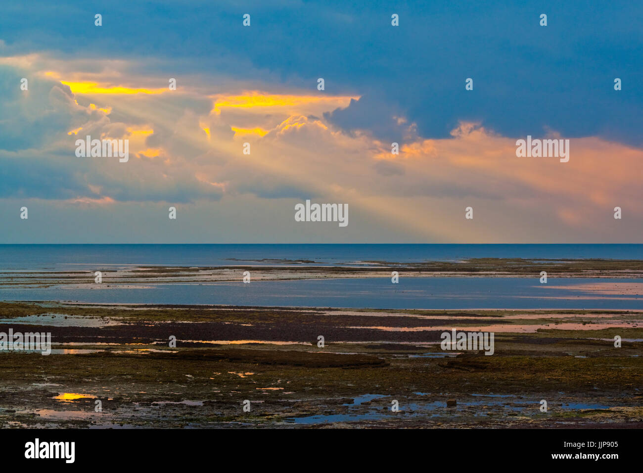 Sunset with shafts of sunlight off the west coast of this popular holiday island. Ile de Ré; Charente-Maritime; France Stock Photo