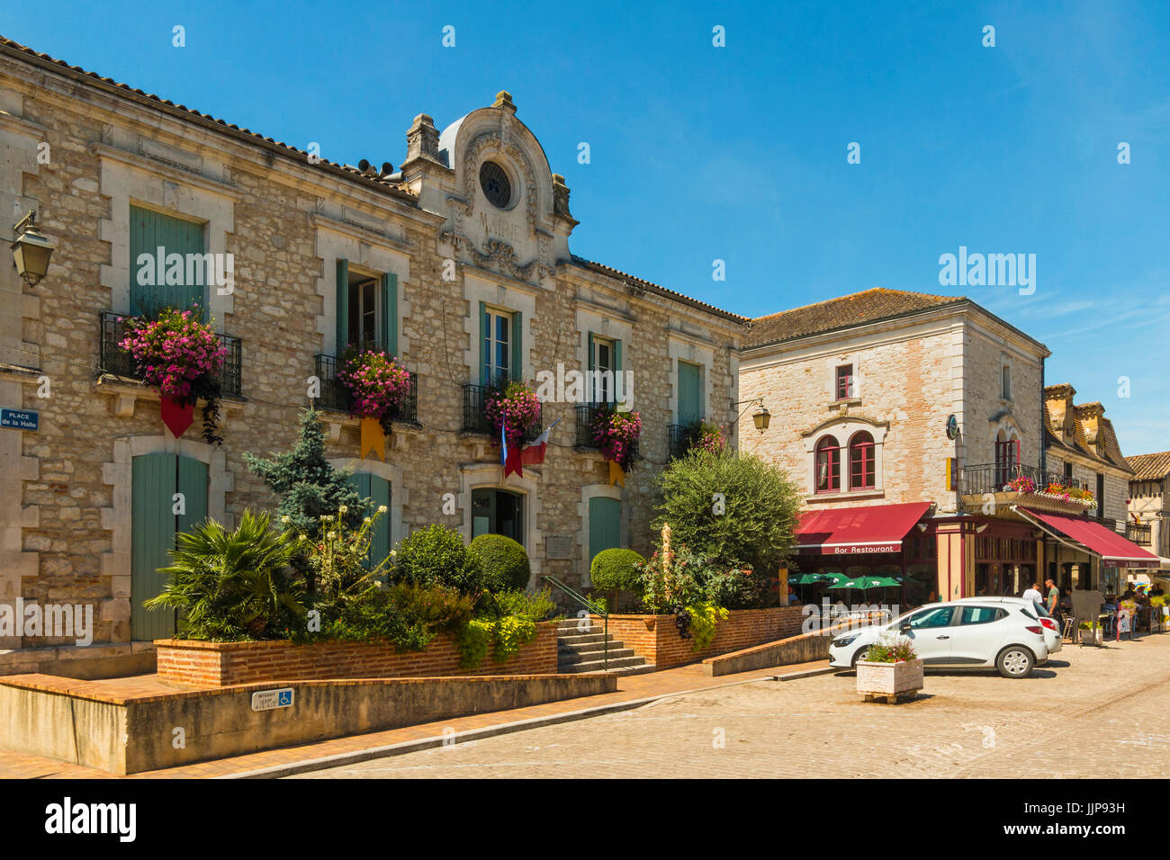 Mairie (Town Hall) decorated with flowers on Place de la Halle in this pretty south west bastide town. Villereal; Lot-et-Garonne; France Stock Photo
