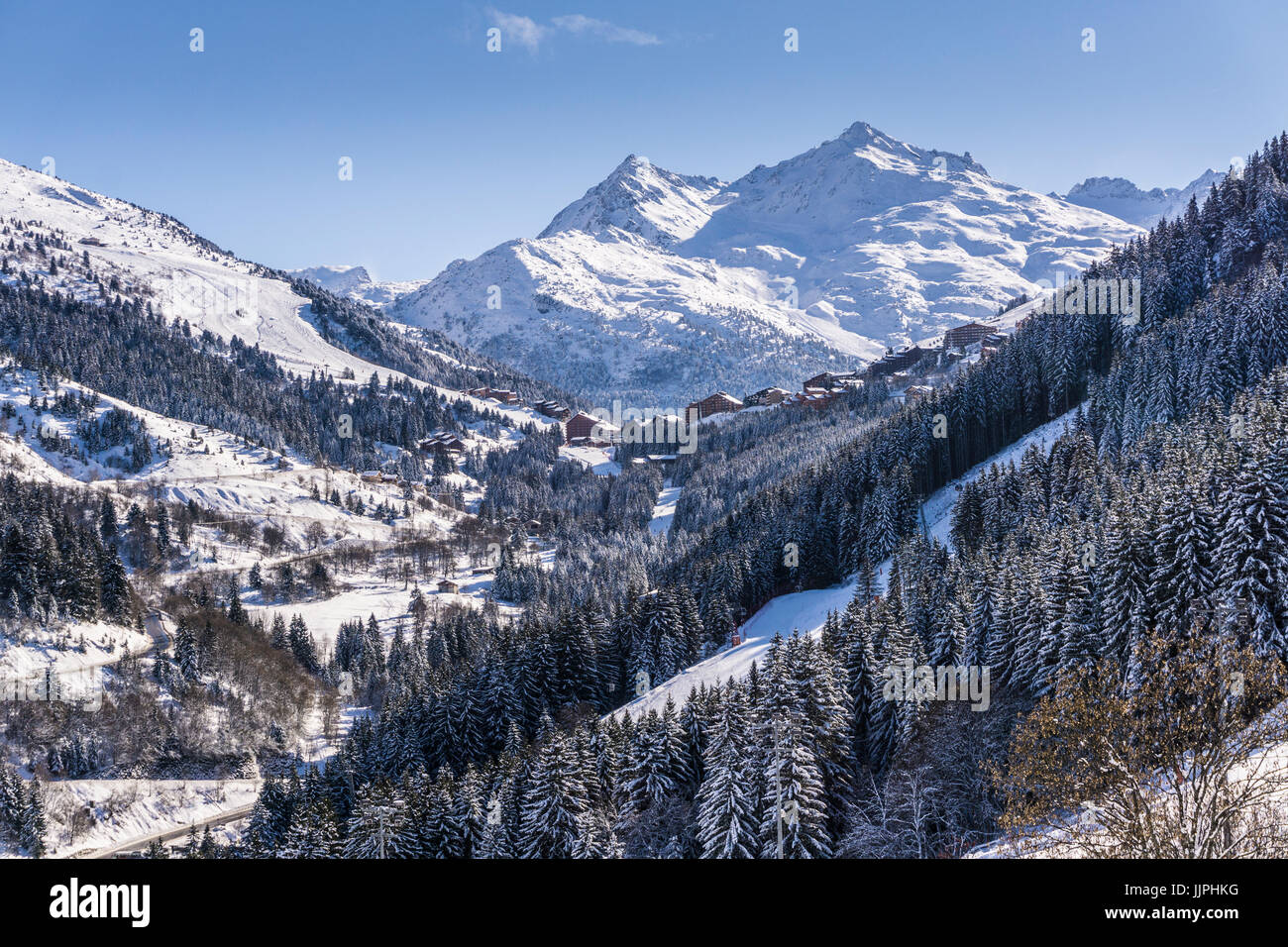 View towards chalets at Merribel Motteret from Meribel in the French Alps. Stock Photo