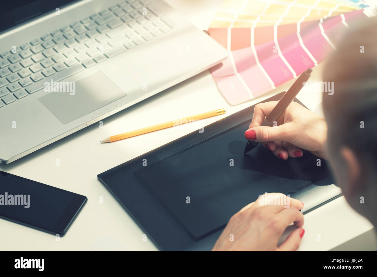 Graphic designer drawing digital tablet hires stock photography and