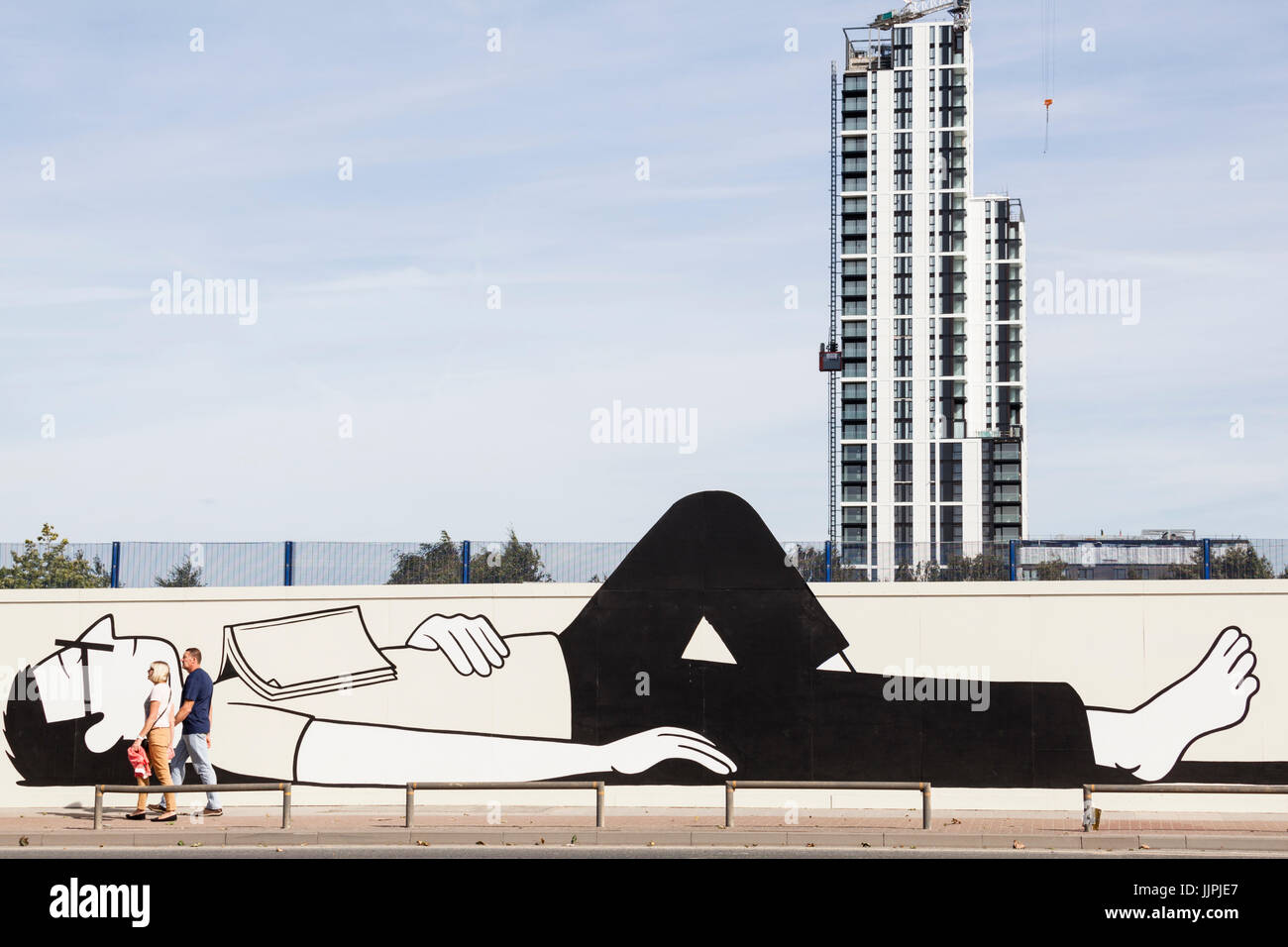 Architectural hoardings screen the redevelopment of Greenwich Peninsula. Stock Photo
