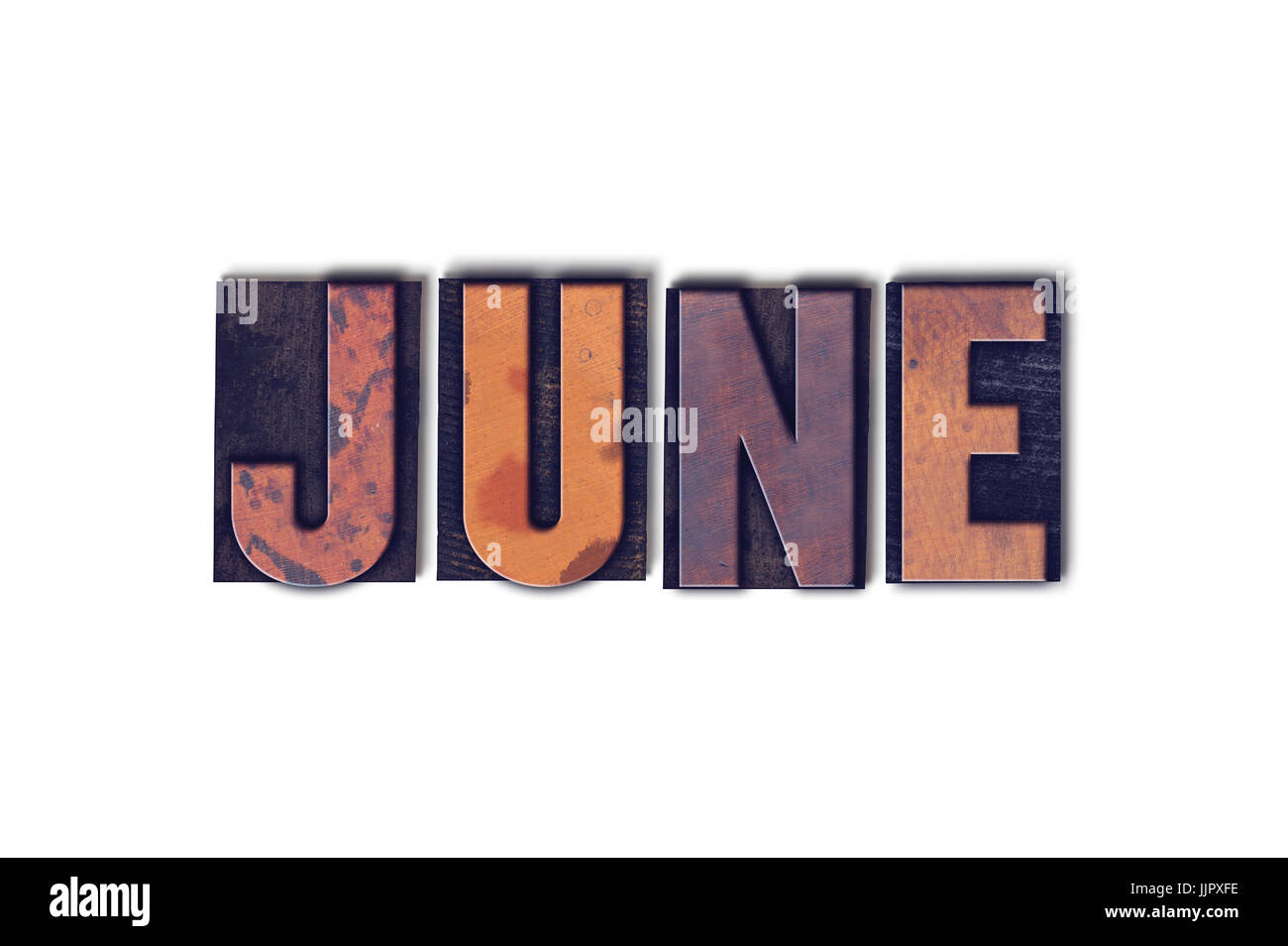 The word June concept and theme written in vintage wooden letterpress