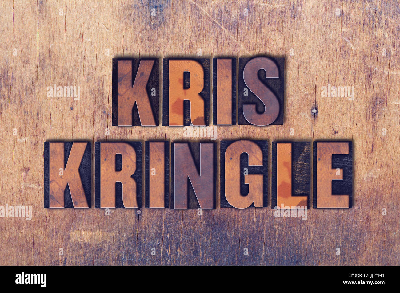 The name Kris Kringle concept and theme written in vintage wooden