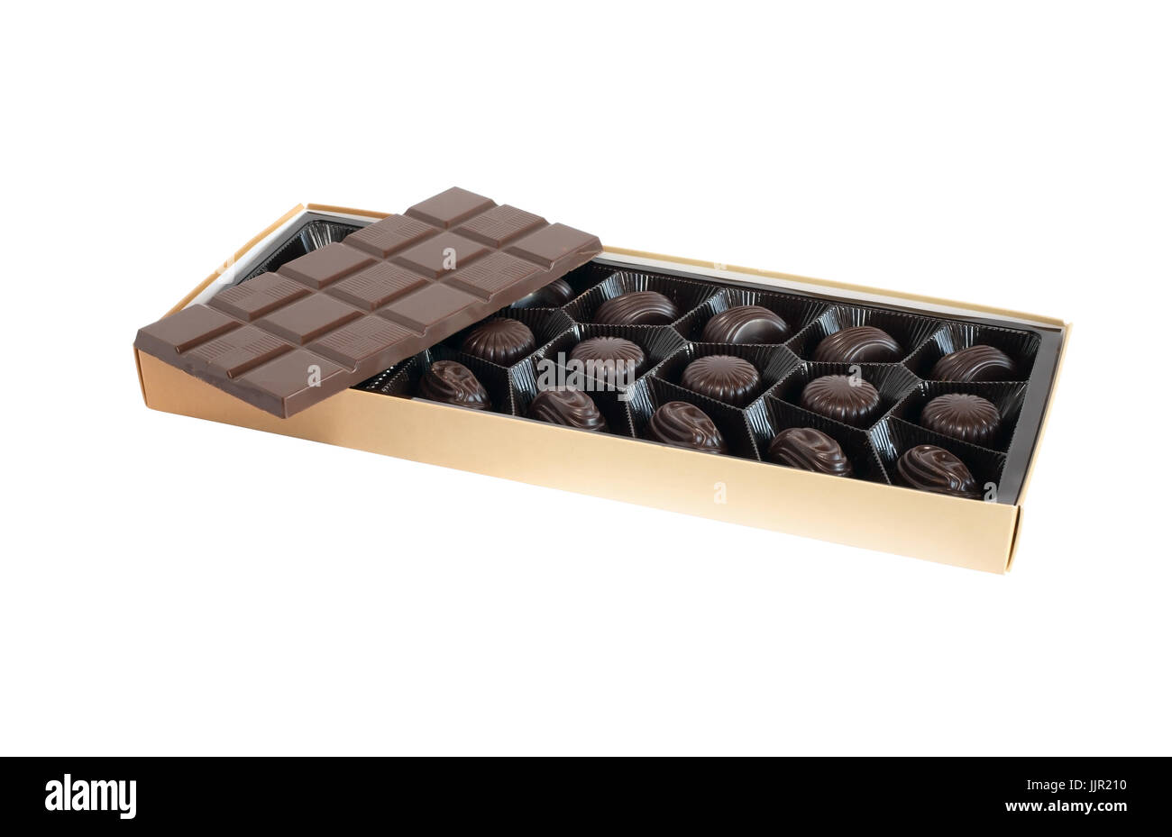Bar of chocolate on box with candies on white background. Isolated with clipping path Stock Photo