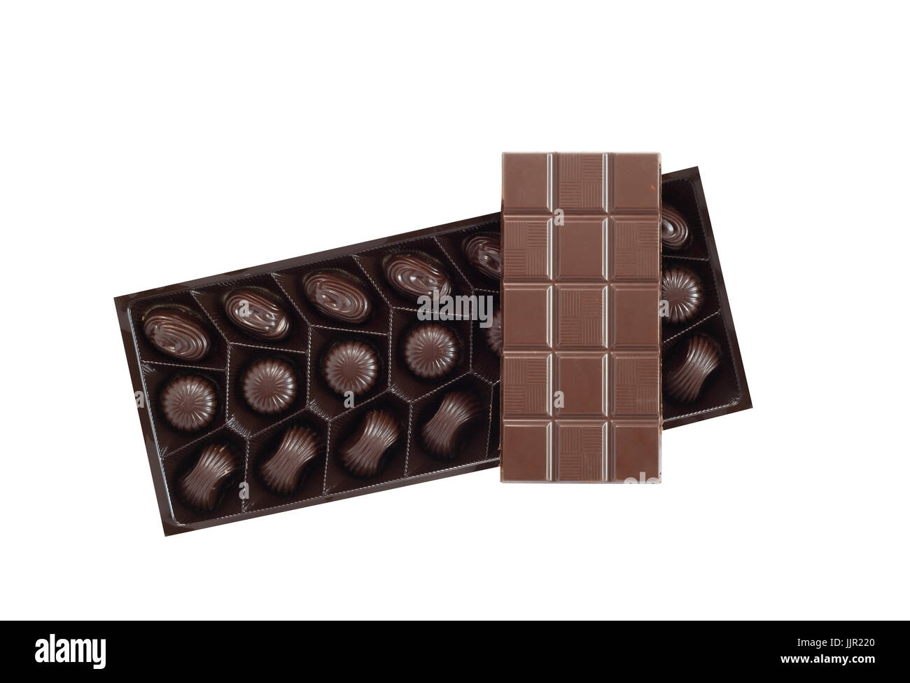 Bar of chocolate on box with candies on white background. Isolated with clipping path Stock Photo