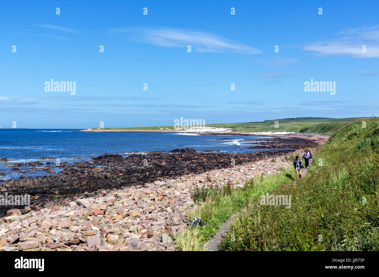 John O'Groats, Scotland. Walkers on footpath from John O'Groats to Duncansby Head, the actual most north easterly point in mainland UK. Stock Photo