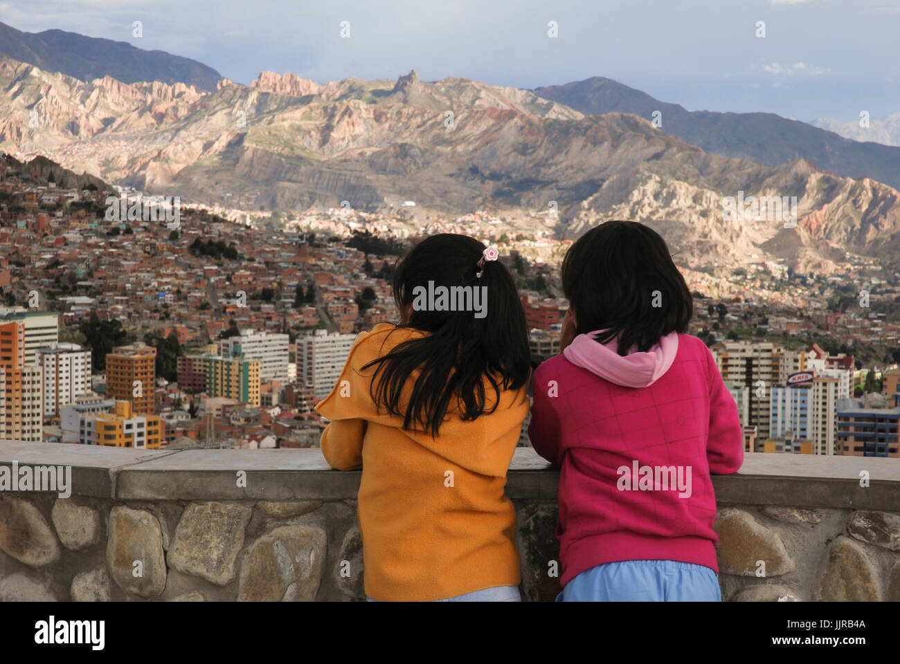 Two little girls looking over La Paz city from Killi Killi viewpoint. Bolivia, South America Stock Photo