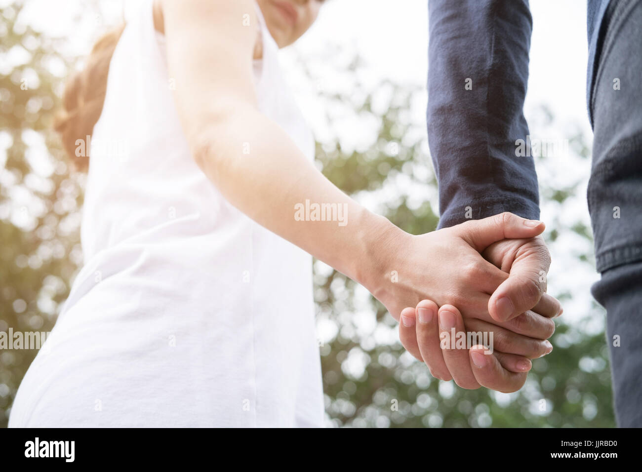 Asian couple holding hands hi-res stock photography and images - Alamy