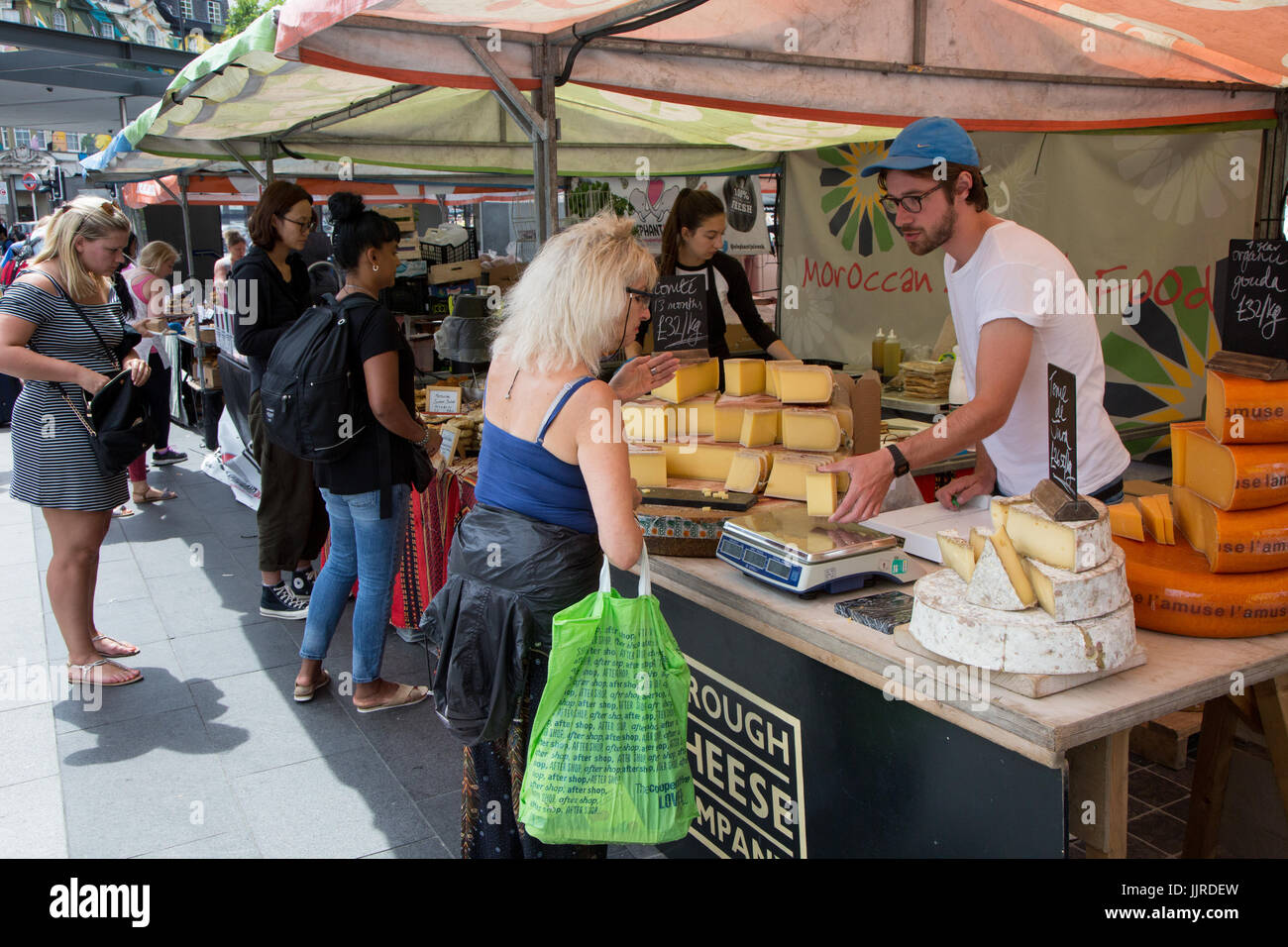 Cheese seller at the Real Food Market in King's Cross, open every