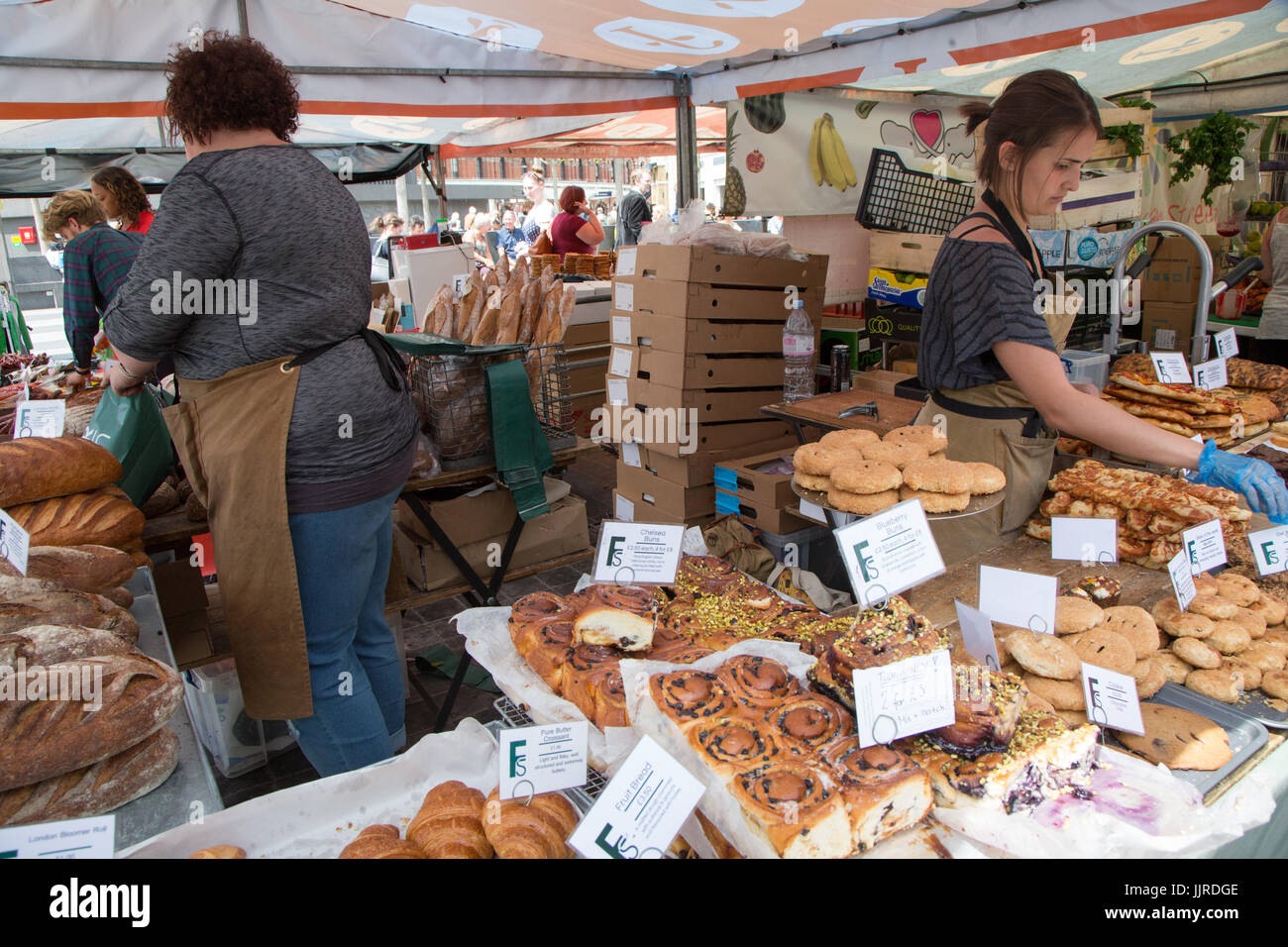 Market traders at King's Cross Real Food Market Stock Photo