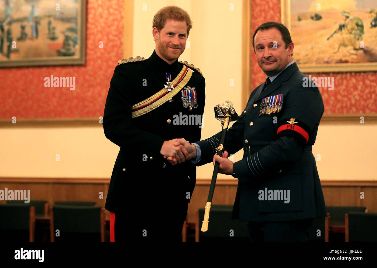 Prince Harry presents the Firmin Sword of Peace to the Royal Air Force Police during an official visit to RAF Honington in Bury St Edmunds. Stock Photo