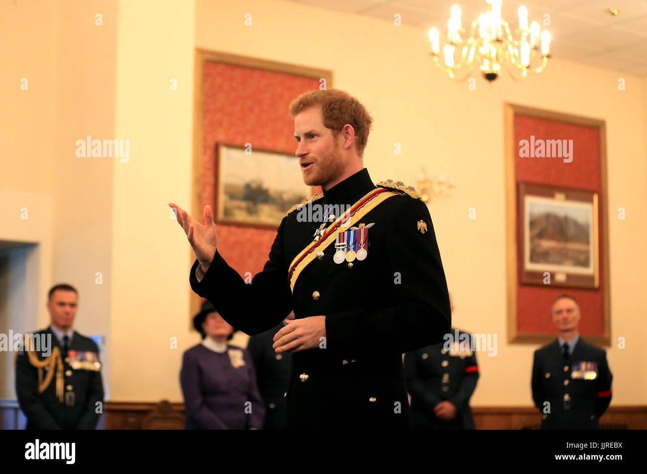Prince Harry presents the Firmin Sword of Peace to the Royal Air Force Police during an official visit to RAF Honington in Bury St Edmunds. Stock Photo