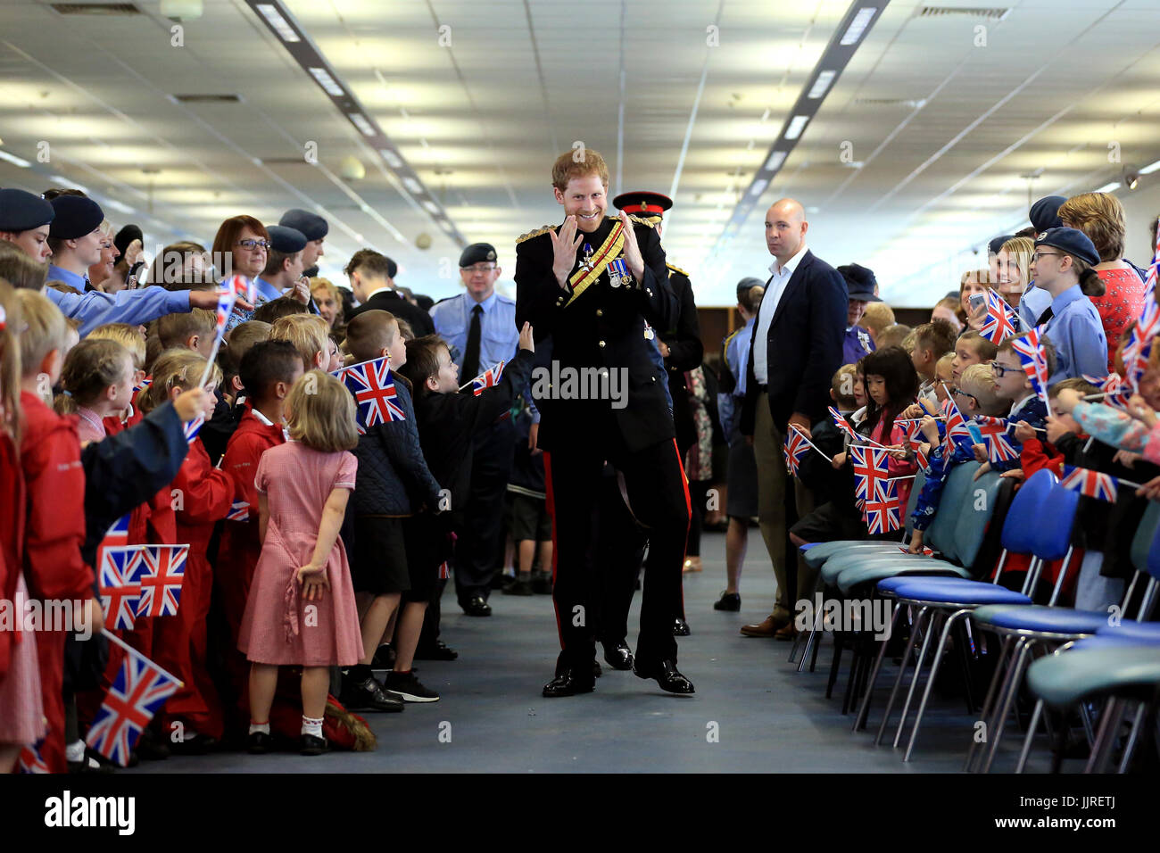 Prince Harry meets schoolchildren and families during an official visit to RAF Honington in Bury St Edmunds. Stock Photo