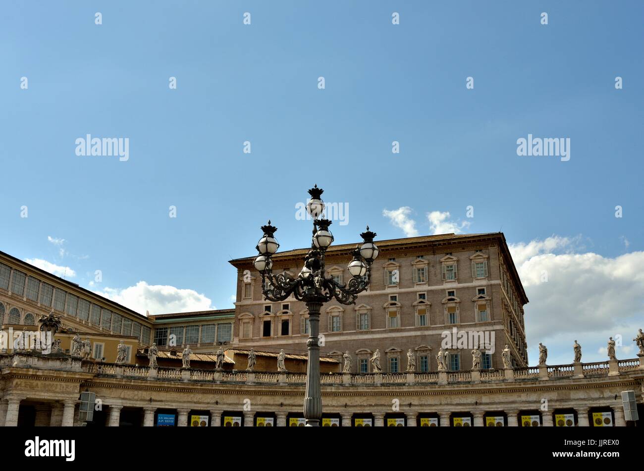 Lamppost in St. Peter's Basilica square with Bernini's statues in a row at the Vatican City, Europe Stock Photo