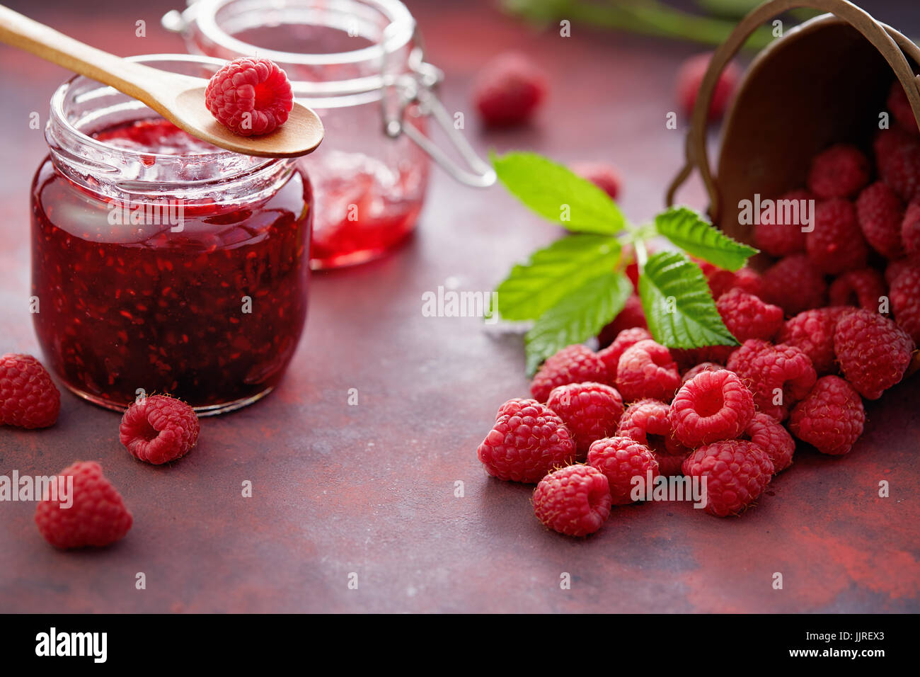 Fresh raspberries and a jar of raspberry jam Stock Photo - Alamy