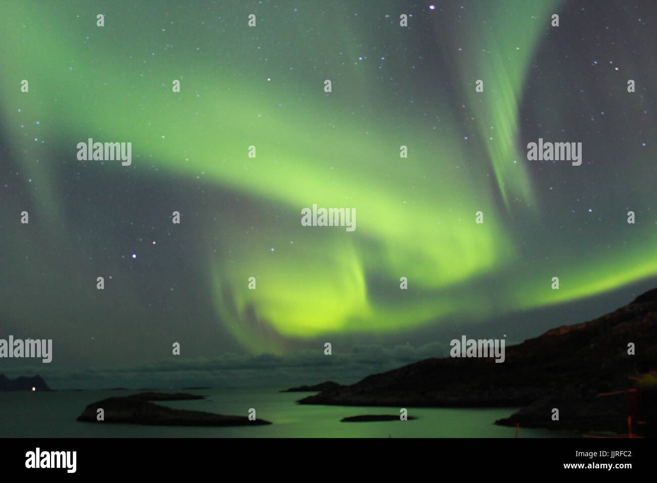 Northern lights over the Fjords in Tromso Stock Photo - Alamy