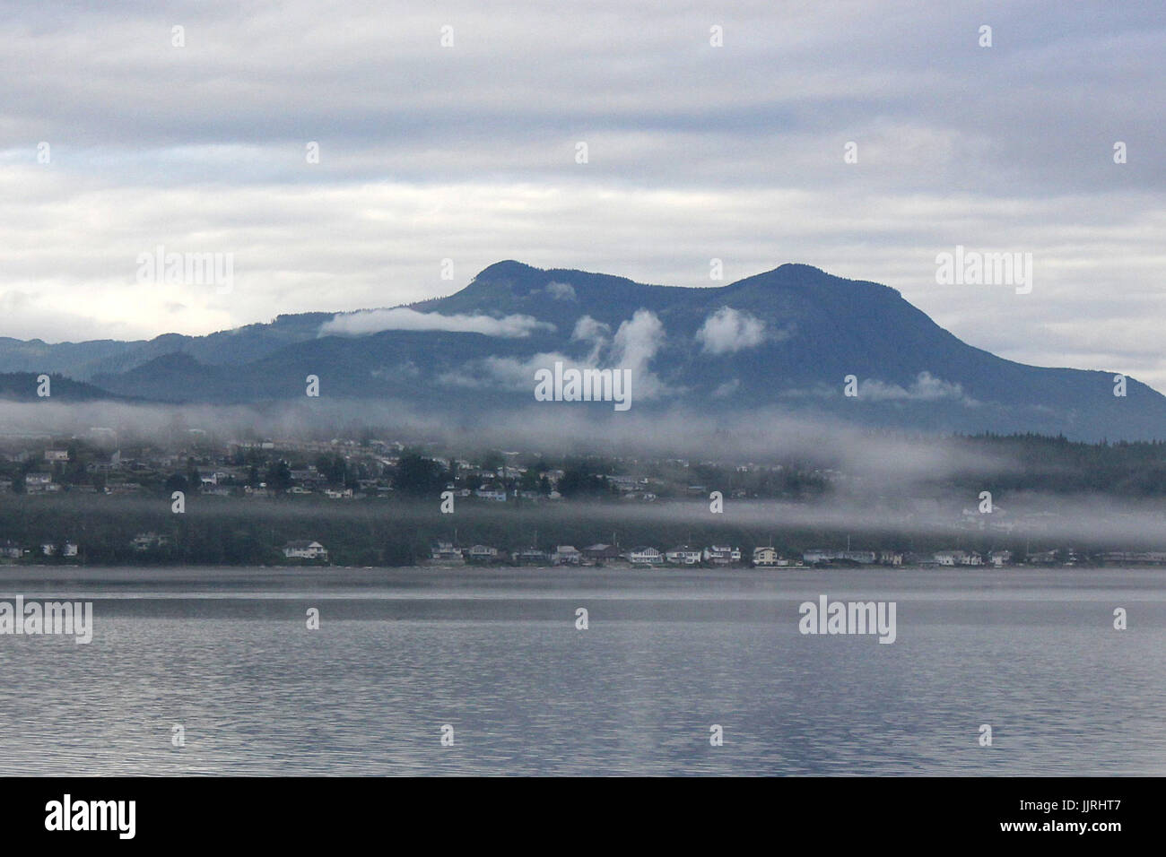 Mist over the Northern Vancouver Island town of Port McNeill, in British Columbia Stock Photo