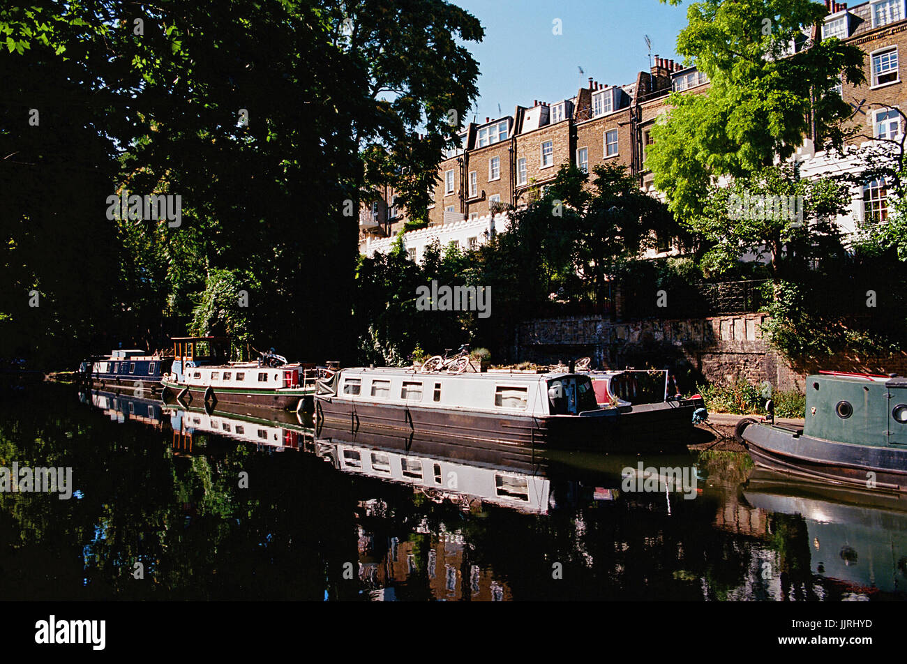 Narrowboats and Georgian houses on the Regents Canal at Islington, North London UK Stock Photo