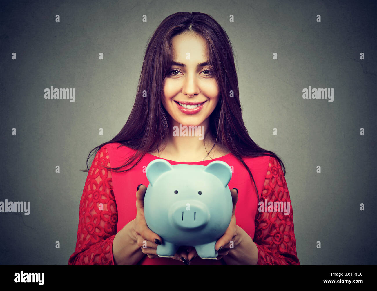 Happy woman with piggy bank Stock Photo - Alamy