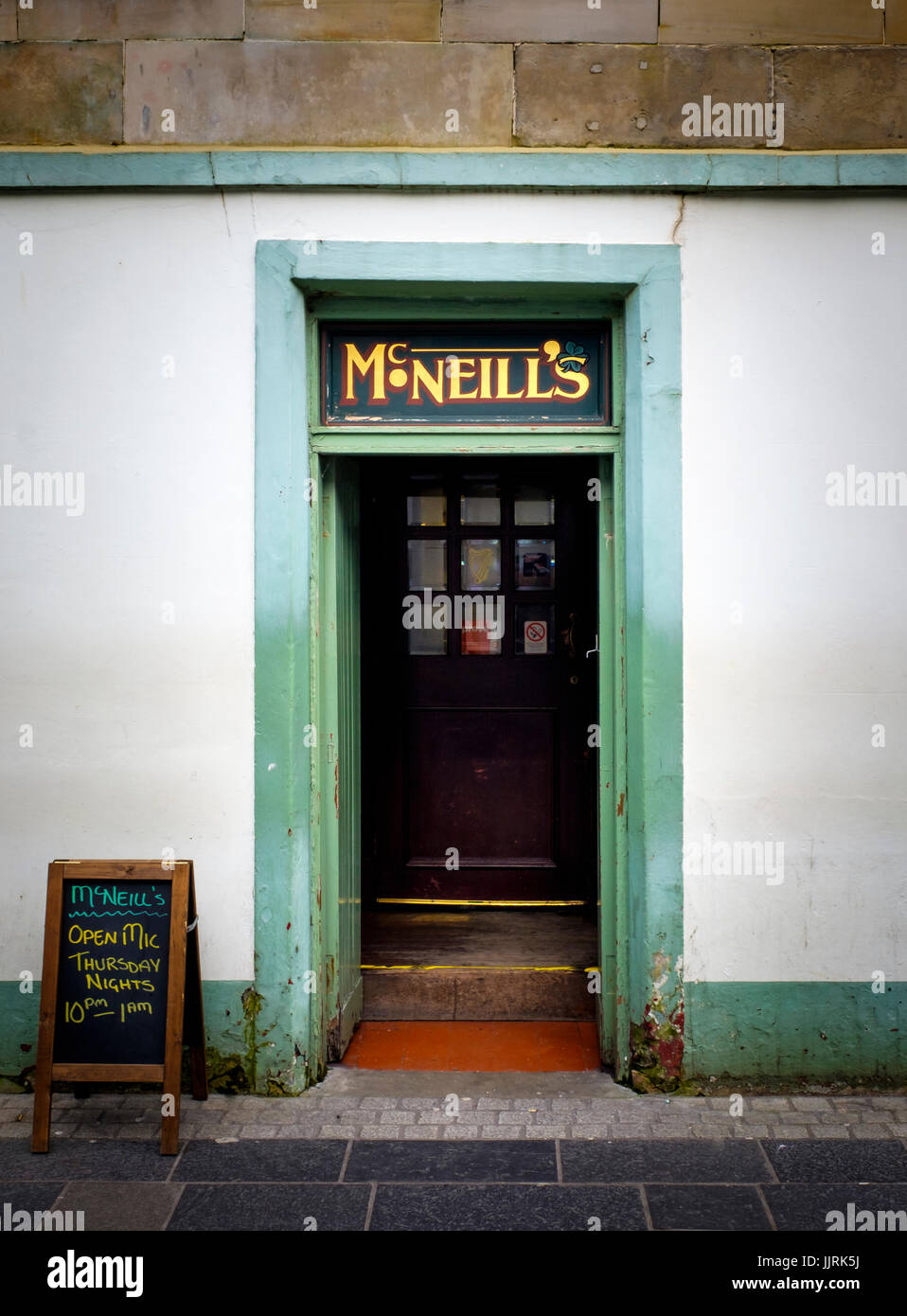 LEWIS AND HARRIS, SCOTLAND - CIRCA APRIL 2016: Entrance door of typical pub in Stornoway one of the major towns of outer islands of Lewis and Harris i Stock Photo