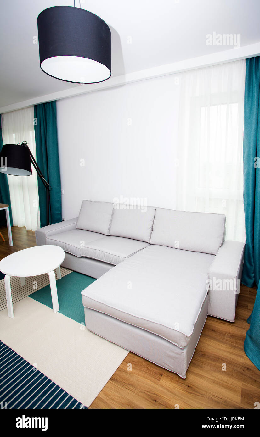 Cozy and bright living room with sofa and furniture Stock Photo - Alamy