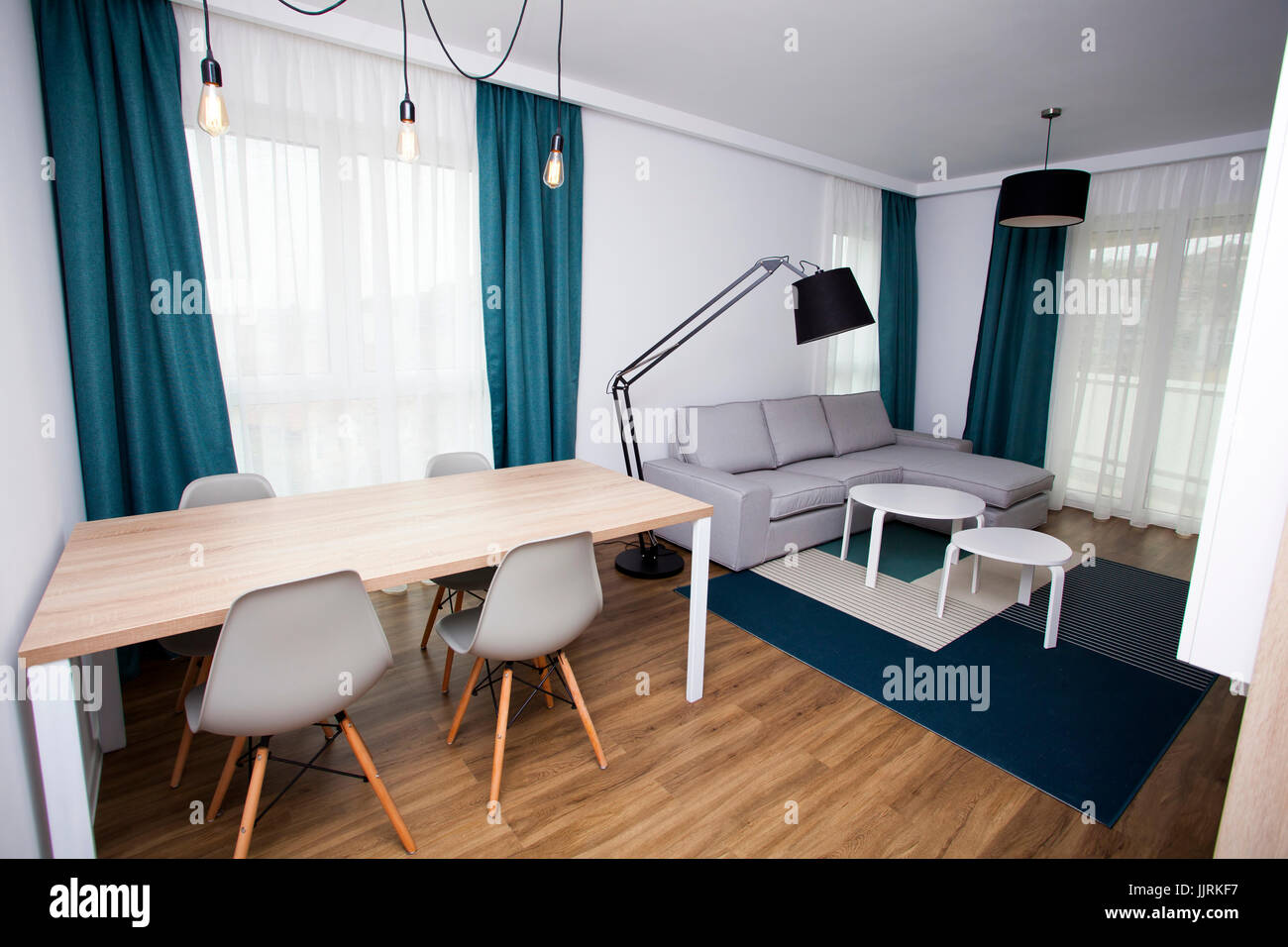 Cozy and bright living room with sofa and furniture Stock Photo - Alamy