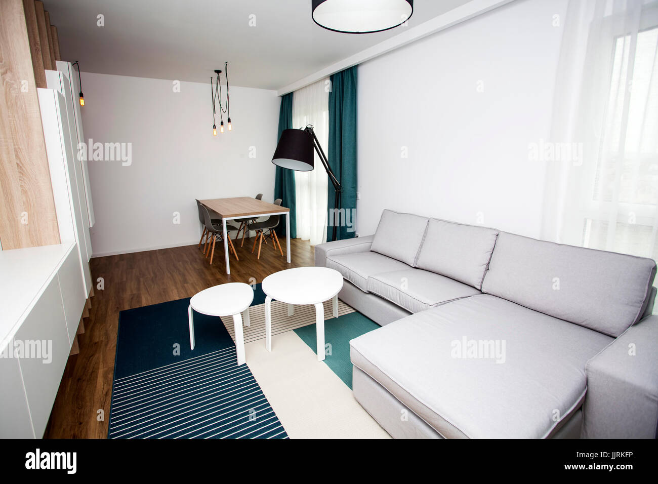 Cozy and bright living room with sofa and furniture Stock Photo - Alamy